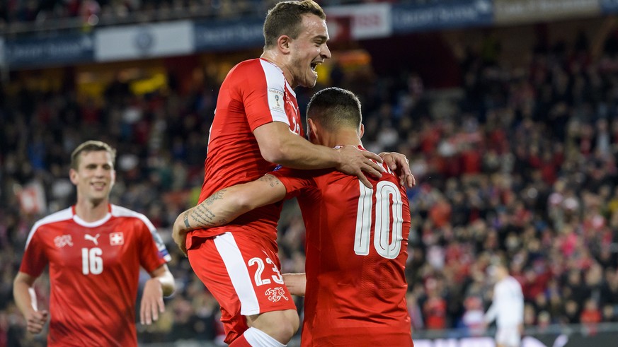 Switzerland&#039;s Granit Xhaka, right, celebrates after scoring the 1:0 with Switzerland&#039;s Xherdan Shaqiri, center, and Switzerland&#039;s Fabian Frei, left, during the 2018 Fifa World Cup Russi ...