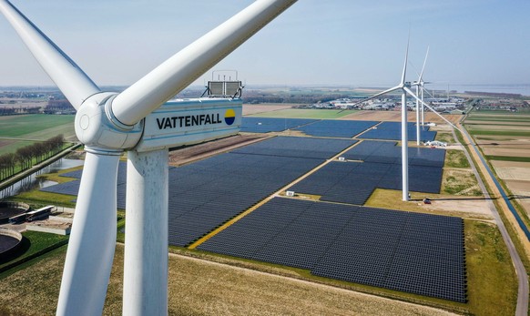 epa09842202 A picture taken with a drone shows windmills of the Haringvliet energy park in Middelharnis on Goeree-Overflakkee, the Netherlands, 22 March 2022. The energy park consists of six windmills ...