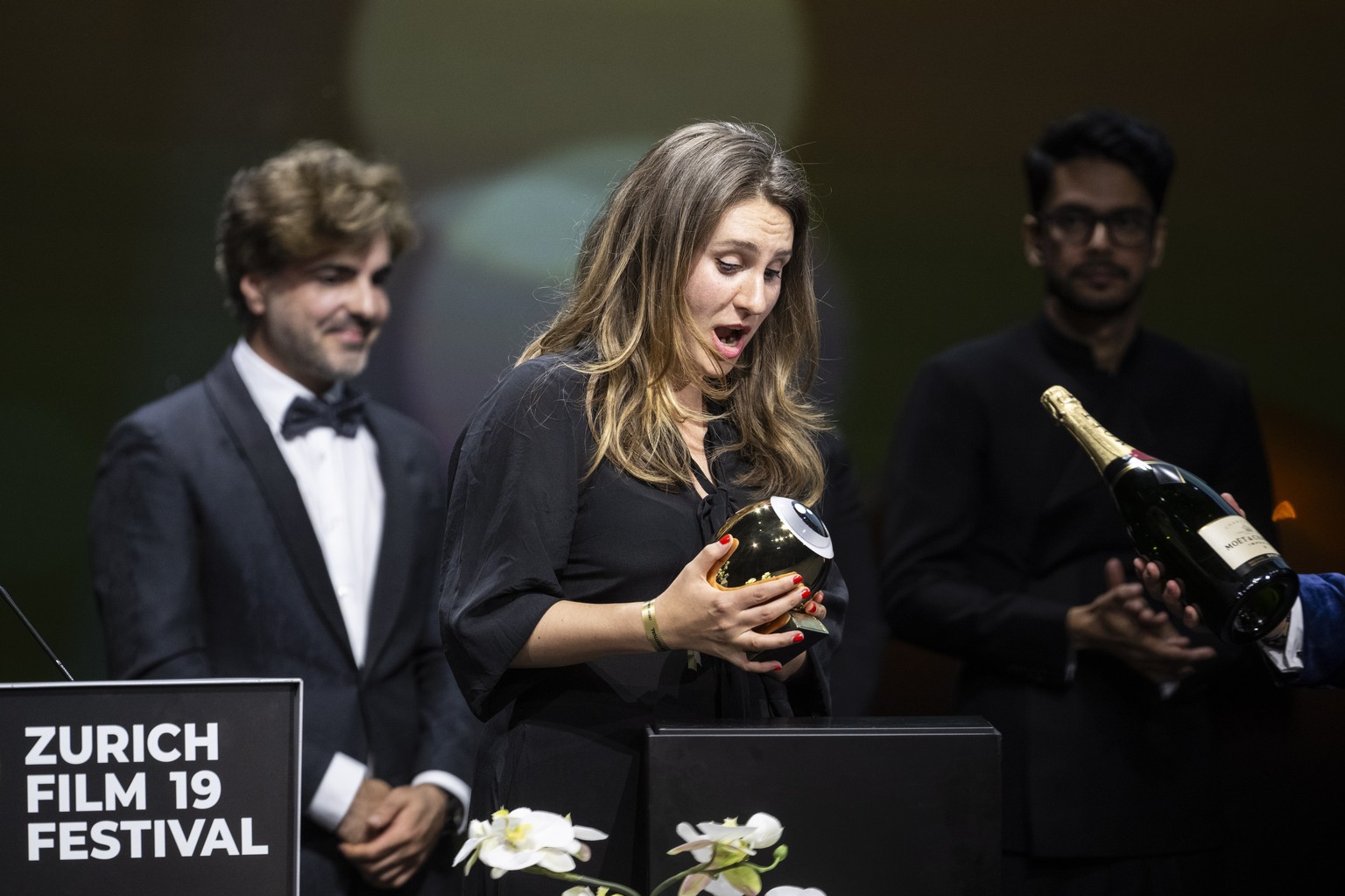 epa10906539 Kseniia Marchenko (C) accepts the award on behalf of Maciek Hamela for his movie &#039;In the rearview&#039; during the Award Night ceremony of 19th Zurich Film Festival (ZFF) in Zurich, S ...