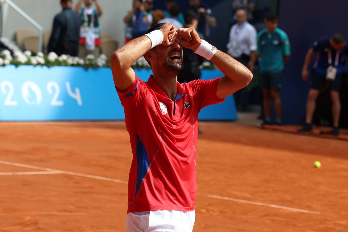 August 4, 2024, Paris, Ile-De-France, France: NOVAK DJOKOVIC of Serbia reacts to defeating CARLOS ALCARAZ of Spain, thus grabbing his elusive gold medal in the Tennis Men s Singles final at the Paris  ...