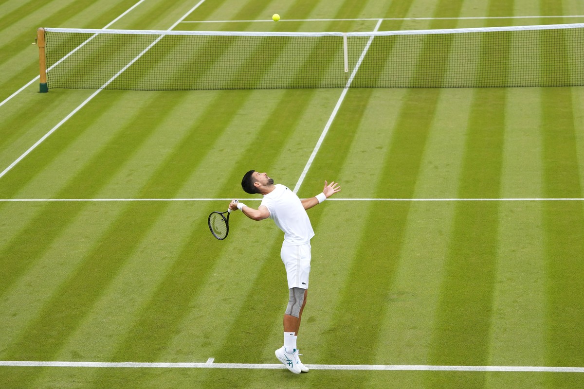 Novak Djokovic of Serbia serves during a training session on Court 2 at the All England Lawn Tennis and Croquet Club in Wimbledon, London, Friday, June 28, 2024. The Wimbledon Championships begin on J ...