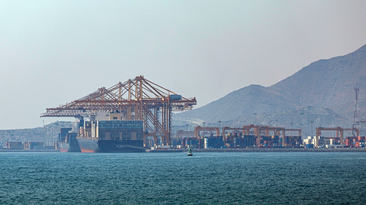 epa13095211 A container ship docks at Khor Fakkan Port, in Khor Fakkan, United Arab Emirates, 07 July 2026. As one of the upcoming measures for the UAE to avoid sending its shipping vessels through th ...