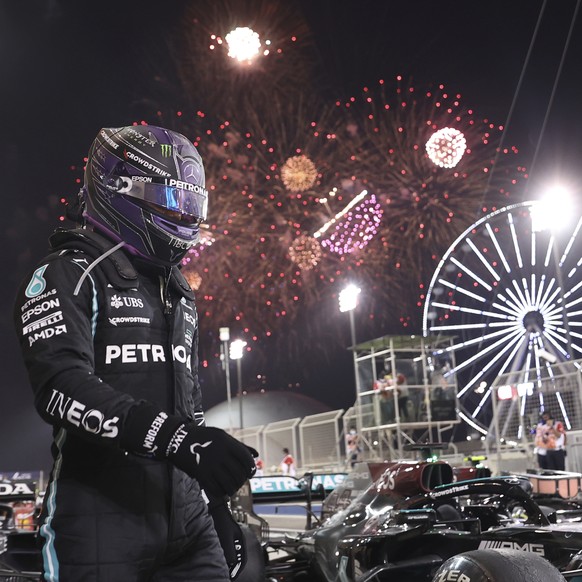 Mercedes driver Lewis Hamilton of Britain celebrates winning the Bahrain Formula One Grand Prix at the Bahrain International Circuit in Sakhir, Bahrain, Sunday, March 28, 2021. (Lars Baron, Pool via A ...