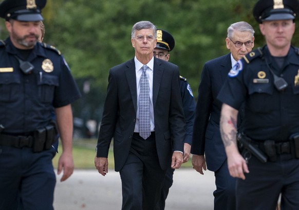 FILe - In this Oct. 22, 2019, file photo Ambassador William Taylor, is escorted by U.S. Capitol Police as he arrives to testify before House committees as part of the Democrats impeachment investigati ...