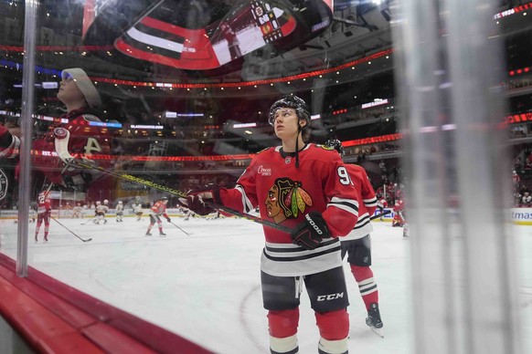 Chicago Blackhawks center Connor Bedard tosses a puck to a fan before an NHL hockey game against the Boston Bruins, Wednesday, Dec. 4, 2024, in Chicago. (AP Photo/Erin Hooley)
Connor Bedard