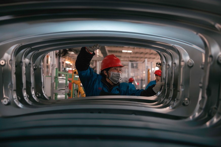 epa10974405 A person works in BYD electric cars factory in Changzhou, Jiangsu Province, China, 14 November 2023. According to published data, the output of BYD Changzhou base from January to July this ...