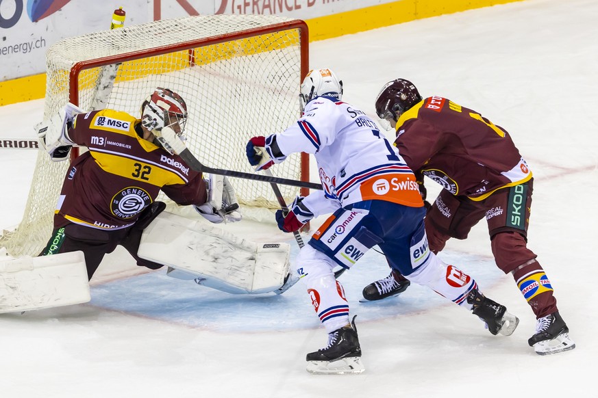 The goaltender Antti Raanta (GSHC) #32 saves a shot from Chris Baltisberger (ZSC), centre, past Giancarlo Chanton (GSHC), right, during a National League regular season game of the Swiss Championship  ...
