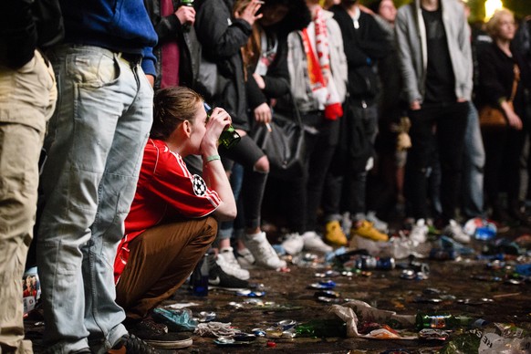 A Liverpool Fan knees on the Marketplace in Basel after the UEFA Europa League final between England&#039;s Liverpool FC and Spain&#039;s Sevilla Futbol Club at the St. Jakob-Park stadium in Basel, Sw ...
