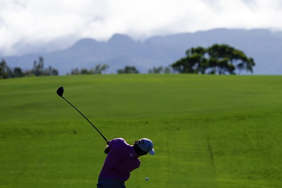 Max Homa hits from the fairway on the fourth hole during the first round of the Tournament of Champions golf event, Thursday, Jan. 6, 2022, at Kapalua Plantation Course in Kapalua, Hawaii. (AP Photo/M ...