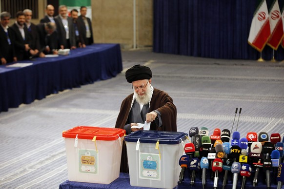 epa11190026 Iranian supreme leader Ayatollah Ali Khamenei casts his vote during the Iranian legislative election in Tehran, Iran, 01 March 2024. Iranians vote for new members of Iran&#039;s parliament ...
