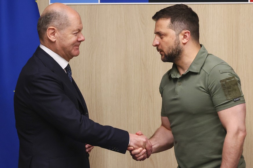 Ukraine&#039;s President Volodymyr Zelenskyy, right, meets with Germany&#039;s Chancellor Olaf Scholz during a NATO summit in Vilnius, Lithuania, Wednesday, July 12, 2023. (Yves Herman, Pool Photo via ...