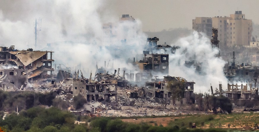 epa10947091 Smoke rises from the northern part of the Gaza Strip as a result of an Israeli airstrike, at an undisclosed location near the border with Gaza, in Israel, 29 October 2023. The IDF conducte ...