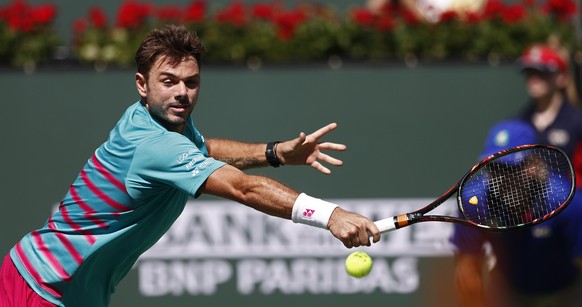 epa05856985 Stan Wawrinka of Switzerland returns a shot against Pablo Carreno Busta of Spain during their semi finals match at the 2017 BNP Paribas Open tennis tournament at the Indian Wells Tennis Ga ...