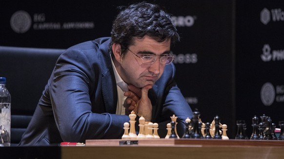 epa06632852 Russian player Vladimir Kramnik contemplates a move during a game of chess with Azerbaijani player Shakhriyar Mamedyarov (unseen), during the 14th round of the FIDE Candidates tournament i ...