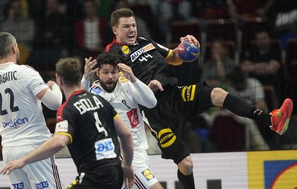 Germany's Christoph Steinert, right, in action during the Handball World Championship quarterfinal match between France and Germany in Gdansk, Poland, Wednesday, Jan. 25, 2023. (AP Photo/Piotr Hawalej ...