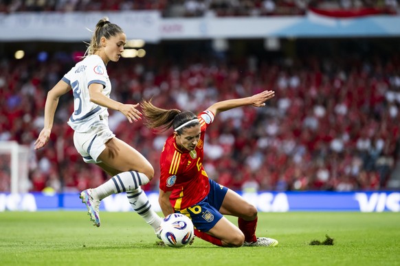 Switzerland&#039;s Viola Calligaris, left, fights for the ball with Spain&#039;s Aitana Bonmati, right, during the UEFA Women&#039;s EURO 2025 quarterfinals soccer match between Spain and Switzerland  ...