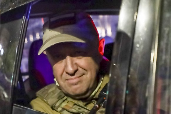 FILE - Yevgeny Prigozhin, the owner of the Wagner Group military company, looks from a military vehicle leaving an area of the HQ of the Southern Military District in a street in Rostov-on-Don, Russia ...
