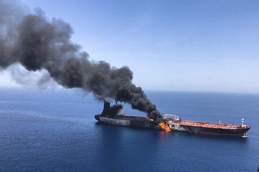 An oil tanker is on fire in the sea of Oman, Thursday, June 13, 2019. Two oil tankers near the strategic Strait of Hormuz were reportedly attacked on Thursday, an assault that left one ablaze and adri ...