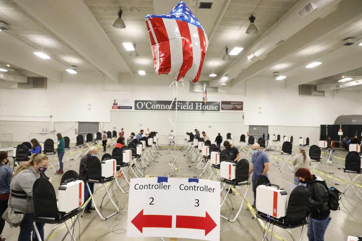 Voters fill out their ballots at O'Connor Field House in Caldwell, Idaho, on Tuesday, Nov. 3, 2020. (AP Photo/Otto Kitsinger)