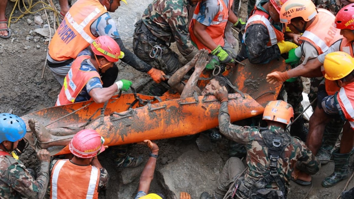 epaselect epa13210503 A handout photo made available by the Nepali Army shows a worker rescued from a hydropower tunnel following flash floods in Rasuwa district, Nepal, 04 September 2026. Two people  ...