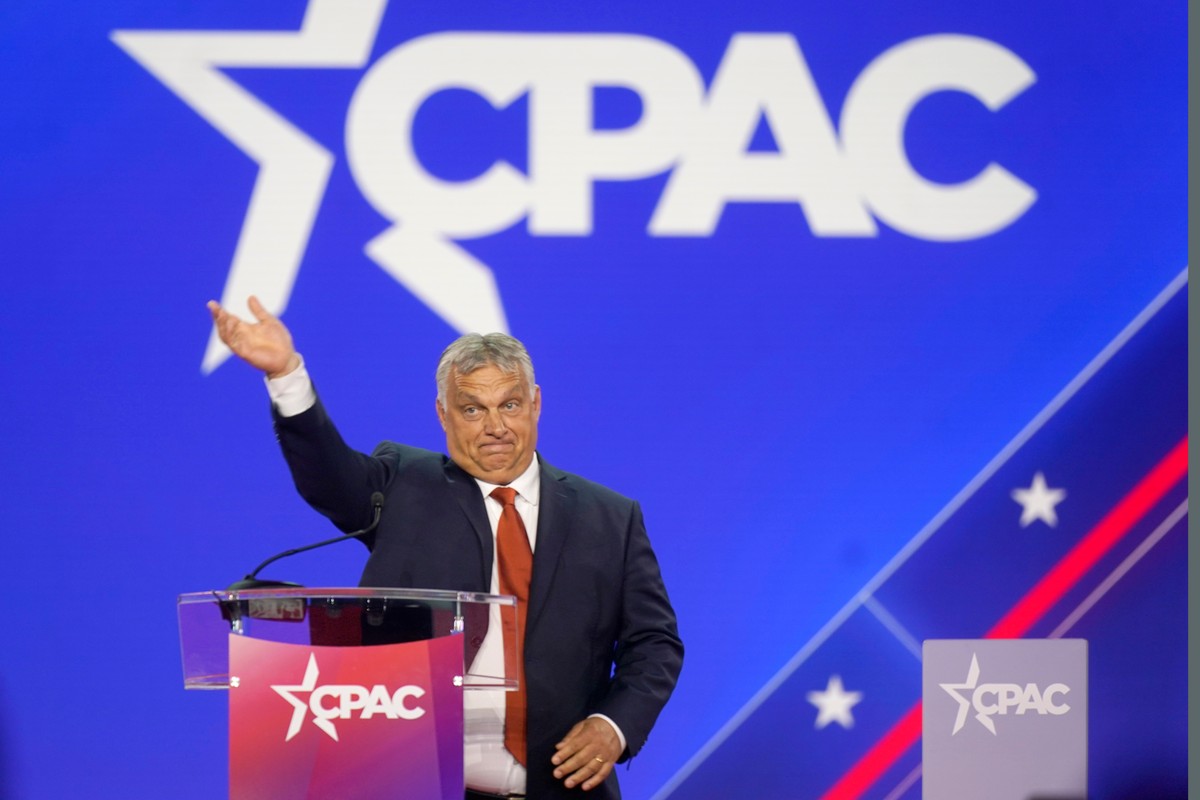 FILE - Hungarian Prime Minister Viktor Orban waves has he walks onto stage to speak at the Conservative Political Action Conference (CPAC) in Dallas, Thursday, Aug. 4, 2022. (AP Photo/LM Otero,File)
V ...