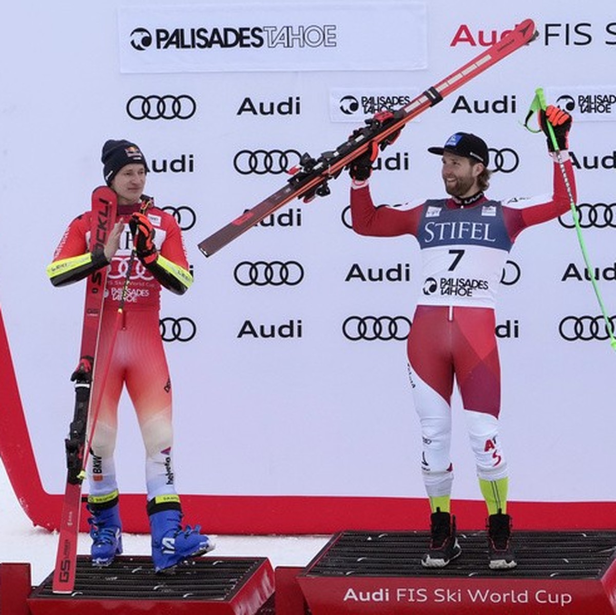 First place finisher Austria's Marco Schwarz, center, poses on the podium with second place finisher Switzerland's Marco Odermatt, left, and third place finisher Norway's Rasmus Winding ...