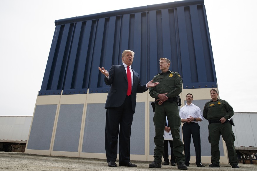 FILE - In this March 13, 2018, file photo, President Donald Trump talks with reporters as he reviews border wall prototypes in San Diego. California&#039;s attorney general filed a lawsuit Monday, Feb ...