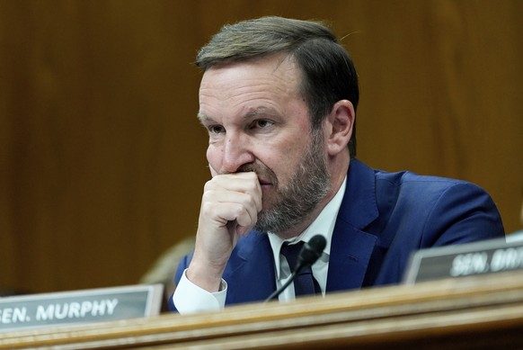 Sen. Chris Murphy, D-Conn., listens as Homeland Security Secretary Kristi Noem speaks during a Senate Appropriations Subcommittee on Homeland Security oversight hearing, Thursday, May 8, 2025, on Capi ...