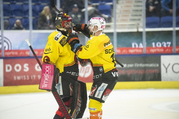 From left, Bern&#039;s goalkeeper Adam Reideborn, Bern&#039;s player Tristan Scherwey celebrate the victory, during the preliminary round game of National League Swiss Championship 2023/24 between HC  ...