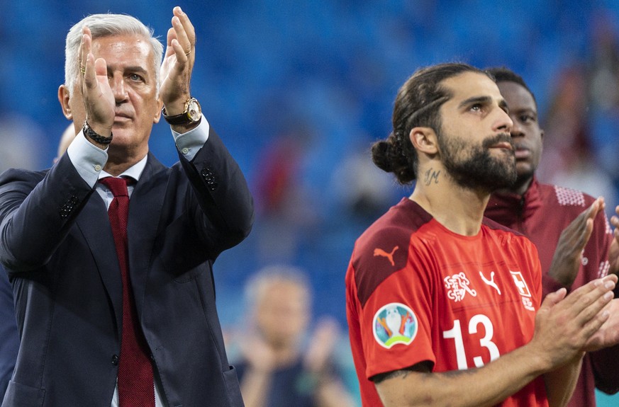 Switzerland&#039;s head coach Vladimir Petkovic, defender Ricardo Rodriguez and midfielder Denis Zakaria, from left, take leave of their supporters after the UEFA Euro 2020 soccer tournament quarterfi ...