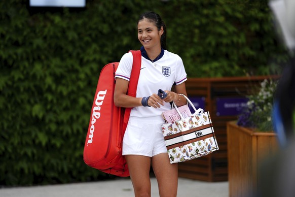 Britain&#039;s Emma Raducanu wearing an England football strip attends a practice session at the All England Lawn Tennis and Croquet Club ahead of the Wimbledon tennis championships in London, Sunday, ...
