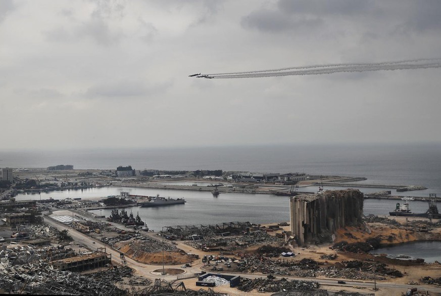 French Alpha Jets of the Patrouille de France spray white lines of smoke, as they fly over the scene of the Aug. 4 explosion that hit the seaport, in Beirut, Lebanon, Tuesday, Sept. 1, 2020. French Pr ...