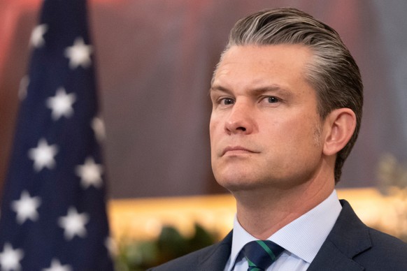 Defense Secretary Pete Hegseth listens during an event at the State Department, Monday, Dec. 8, 2025, in Washington. (AP Photo/Mark Schiefelbein)
Pete Hegseth