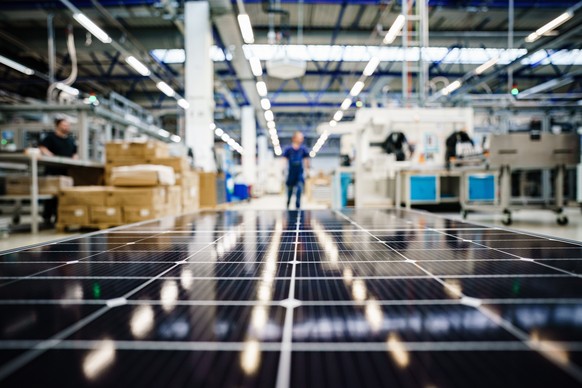 epaselect epa10353827 Light sources from production reflect on the surface of a solar panel at the solar panel manufacturer Meyer Burger (Industries) GmbH in Freiberg, Germany, December 7, 2022. ...