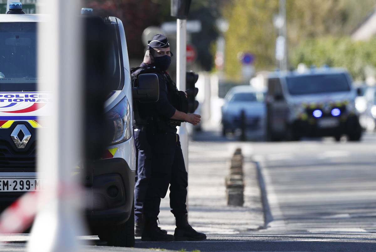 epa09155295 French police officers secure the street near the Police Station in Rambouillet, France, 23 April 2021, following a knife attack. One police officer was attacked and killed by a knifeman,  ...