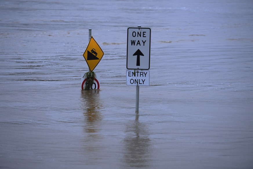 epa09088938 The flooded Nepean River at Trench Reserve at Penrith in Sydney, Australia, 22 March 2021. Thousands of residents are fleeing their homes, schools are shut, and scores of people have been  ...