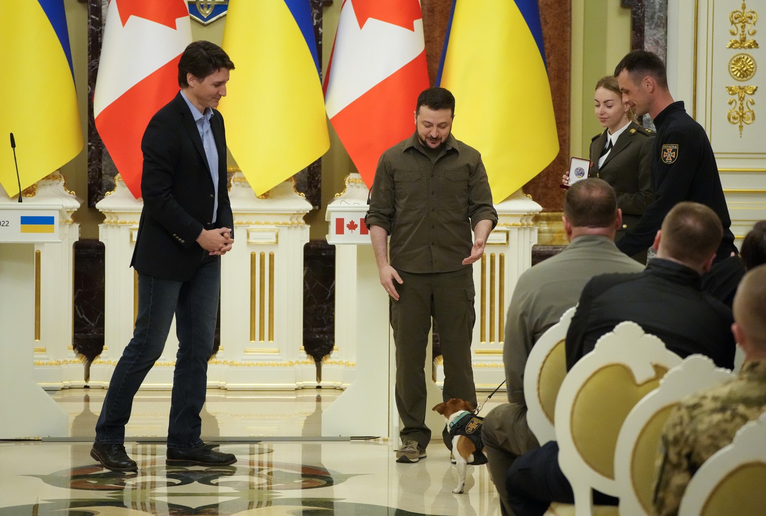 Ukrainian President Volodymyr Zelenskyy, center, and Canadian Prime Minister Justin Trudeau attend an awards ceremony for a Ukrainian sapper and his legendary dog ​​Patron in Kyiv, Ukraine, Sunday May…