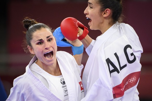 Elena Quirici, left, of Switzerland competes in the women&#039;s karate kumite +61kg fight against Lamya Matoub of Algeria at the 2020 Tokyo Summer Olympics in Tokyo, Japan, on Saturday, August 07, 20 ...