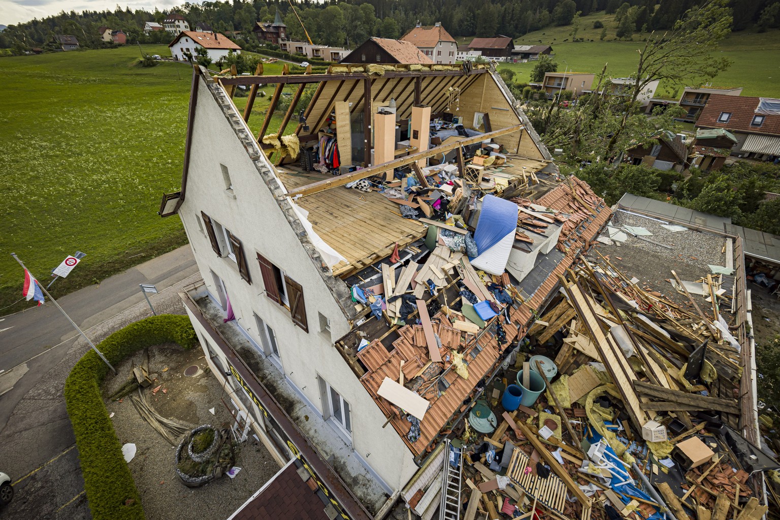A house with its room torn off is pictured after violent storm swept through the city of La Chaux-de-Fonds, Switzerland, Switzerland, Monday, July 24, 2023. A storm swept across part of the canton of  ...
