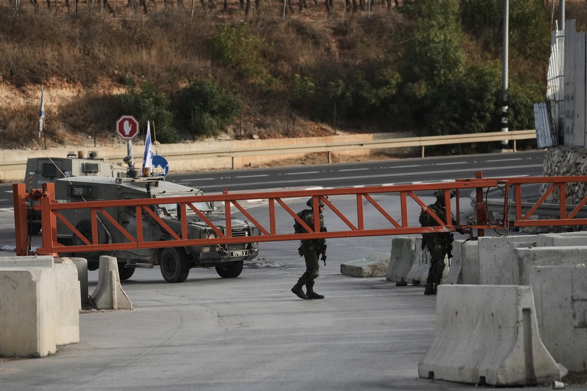 Israeli soldiers close a gate to vehicles during an army operation in Hebron, in the occupied West Bank, Saturday, Oct. 24, 2026, a day after a Palestinian shooting attack in the area. (AP Photo/Mahmo ...