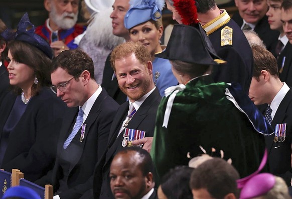 Prince Harry, center, speaks with Anne, the Princess Royal in Westminster Abbey, ahead of the coronation of King Charles III and Camilla, the Queen Consort, in London, Saturday, May 6, 2023. (Richard  ...