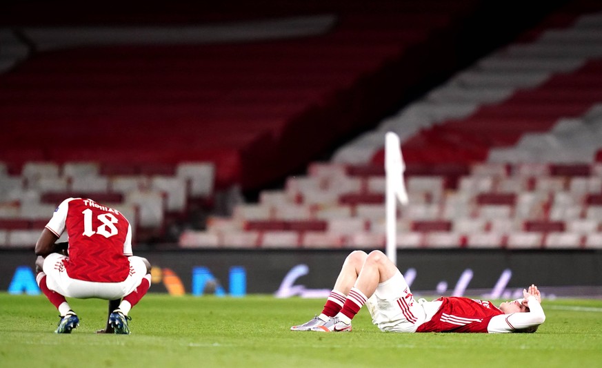 Arsenal v Villarreal - UEFA Europa League - Semi Final - Second Leg - Emirates Stadium Arsenal s Thomas Partey left and Emile Smith-Rowe right react after the UEFA Europa League Semi Final at the Emir ...