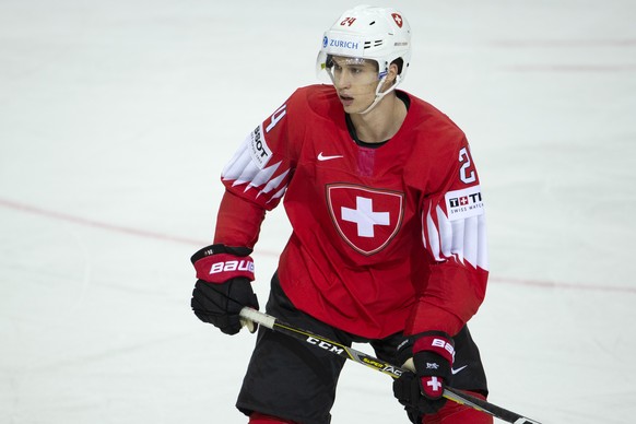 Switzerland&#039;s defender Tobias Geisser look his teammates, during the IIHF 2021 World Championship preliminary round game between Switzerland and Slovakia, at the Olympic Sports Center, in Riga, L ...