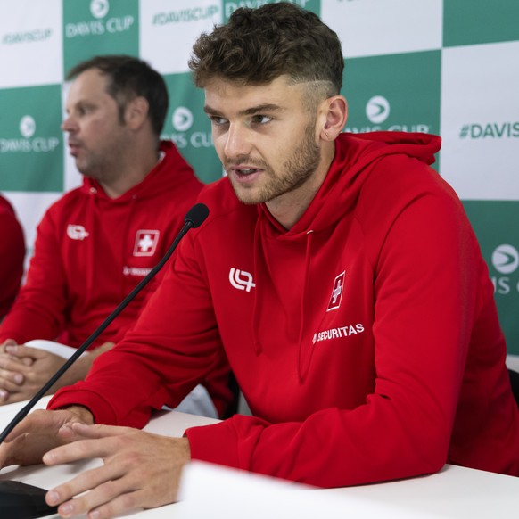 Switzerland&#039;s Jerome Kym, speaks beside team captain Severin Luethi Marc-Andrea Huesler and Dominic Stricker during a press conference of the Swiss Davis Cup team in the Swiss Tennis Arena in Bie ...