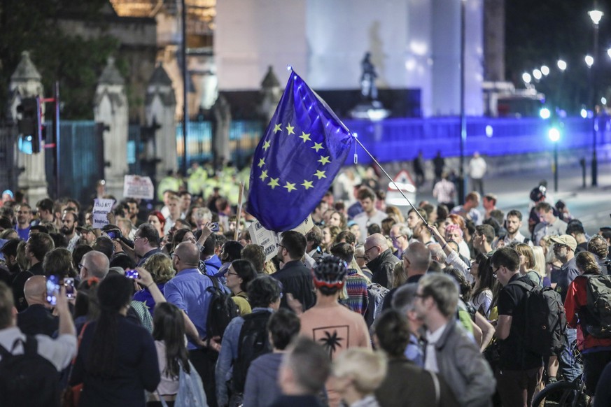 Anti-Brexit supporters continue to participate in a late evening protest in front of the Houses of Parliament in central London, Wednesday, Aug. 28, 2019. British Prime Minister Boris Johnson maneuver ...