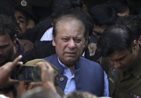 FILE - Former Pakistani Prime Minister Nawaz Sharif leaves a court in Lahore, Pakistan, on October 1.  August 8, 2018. Sharif claims the country's former powerful military and spy chiefs are…