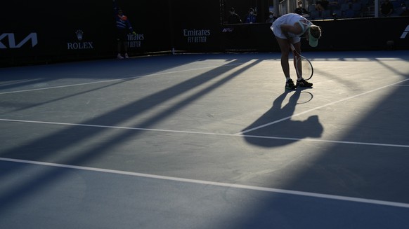 Jil Teichmann of Switzerland reacts to a shot against Petra Martic of Croatia during their first round match at the Australian Open tennis championships in Melbourne, Australia, Monday, Jan. 17, 2022. ...