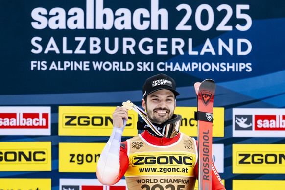 Gold medalist Loic Meillard of Switzerland celebrates during the medals ceremony of the men's Slalom race at the 2025 FIS Alpine World Ski Championships, in Saalbach-Hinterglemm, Austria, Sunday, ...