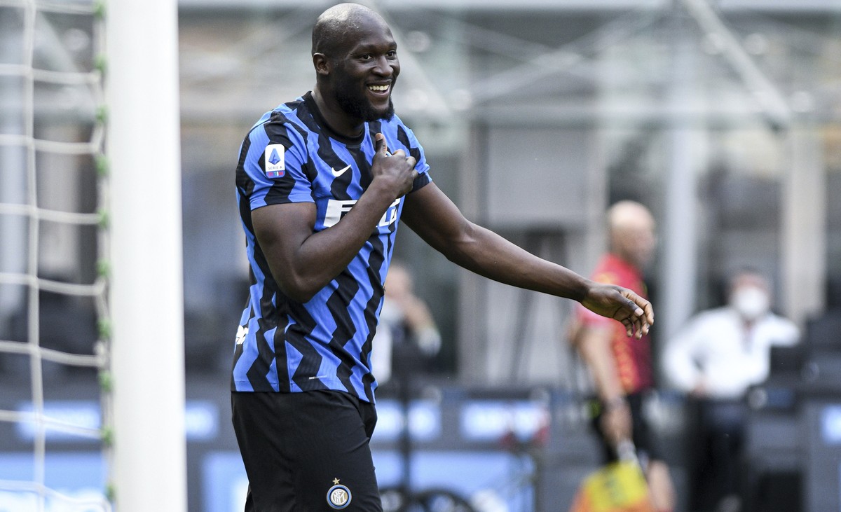 Inter Milan's Romelo Lukaku celebrates after scoring during the Serie A soccer match between Inter and Udinese, at the San Siro stadium in Milan, Italy, Sunday, May 23, 2021. Inter won its first  ...