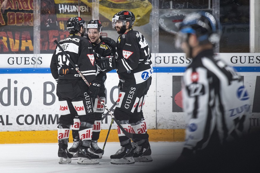 From left, Lugano&#039;s player Luca Cunti, Lugano&#039;s player Marco Mueller and Lugano&#039;s player Giovanni Morini, celebrate the 4-1 goal, during the preliminary round game of the National Leagu ...